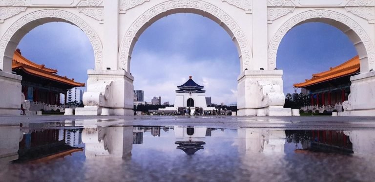 Is Taiwan safe Chiang Kai Shek Memorial archway and plaza reflection in Taipei Caption Description