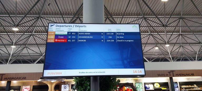 How to get to Madagascar - Departure board at Ivato International Airport in Antananarivo showing flights to Addis Ababa, Johannesburg, and Nairobi