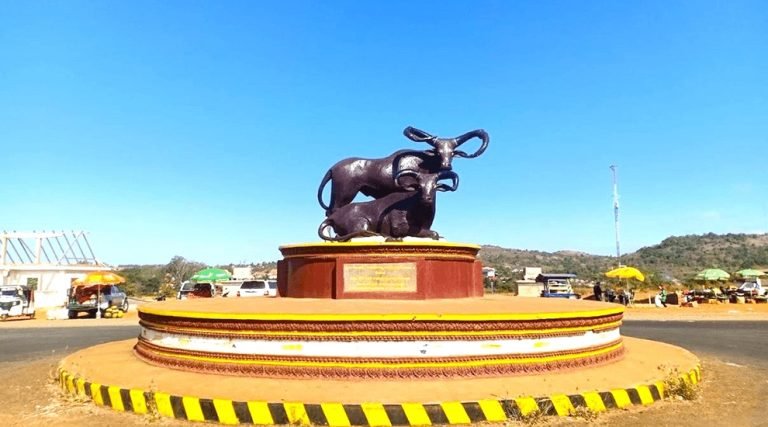 elephant statue monument on a roundabout in mondulkiri cambodia under clear blue sky