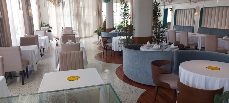 modern restaurant interior in Cambodia with neatly arranged tables and natural light