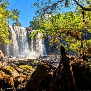 waterfall in northeast cambodia mondulkiri ratanakiri jungle landscape with sunlight and blue sky