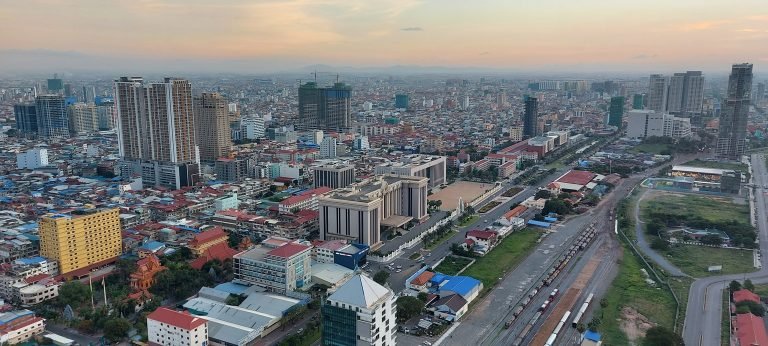 Phnom Penh itinerary aerial view at sunset showing city skyline and urban landscape