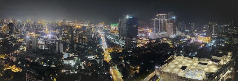 Things to do in Phnom Penh at night skyline view with city lights and riverfront
