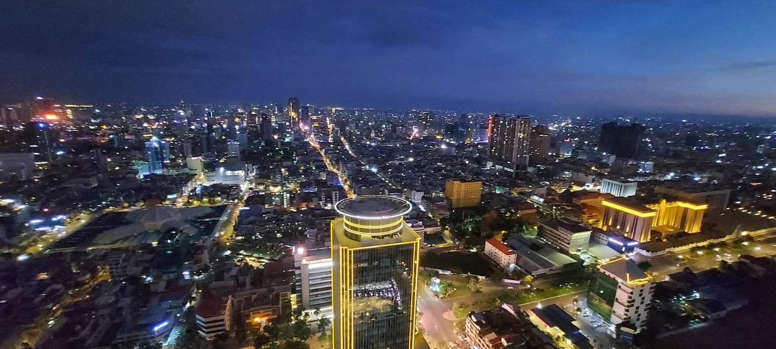 Phnom Penh itinerary skyline view at night with city lights and modern buildings