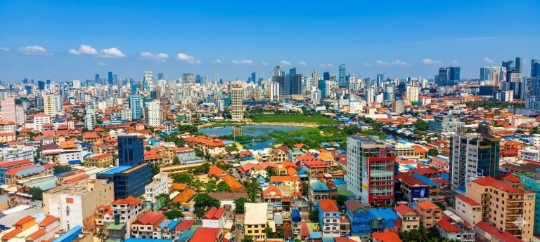 Things to do in Phnom Penh skyline view on a sunny afternoon with blue skies