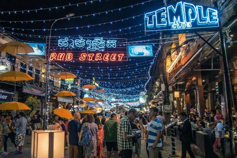 Things to do in Siem Reap at night on Pub Street with bright lights, crowds, and a lively nightlife atmosphere
