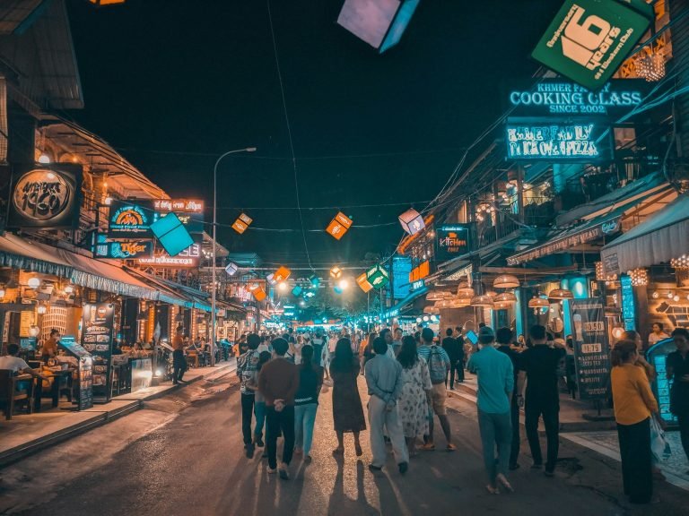 Things to do in Siem Reap at night on Pub Street with crowds, restaurants, and bright neon lights