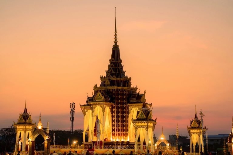 Royal pavilion illuminated at sunset in Battambang Cambodia with traditional Khmer architecture and warm golden light