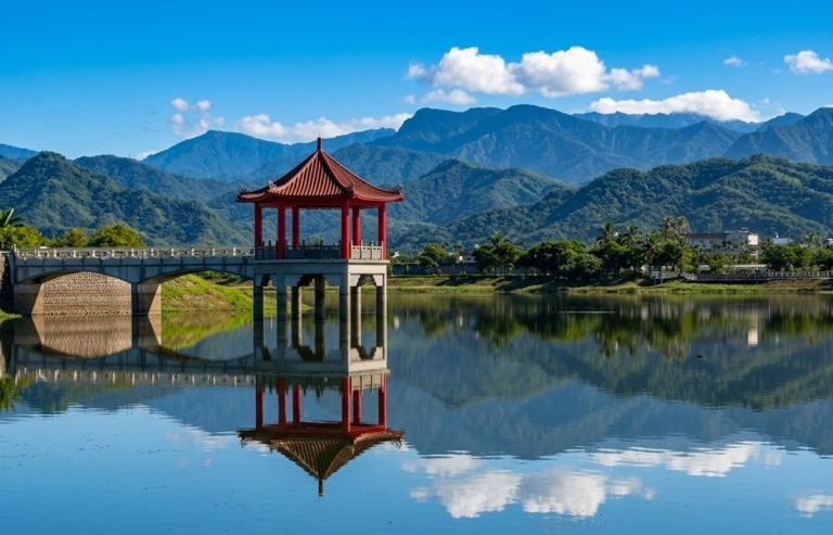 Is Taiwan safe - Peaceful lake with red pavilion and mountains in Taiwan