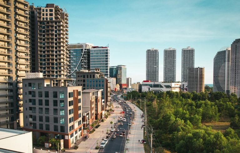Sihanoukville Cambodia skyline with high-rise buildings, wide road, and urban development