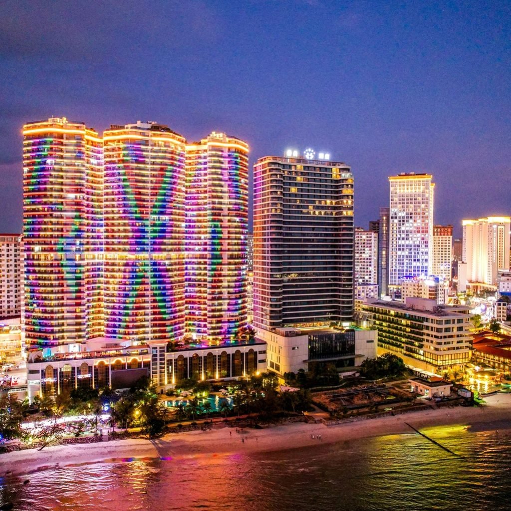 Sihanoukville Cambodia skyline at night with illuminated high-rise buildings along the beachfront