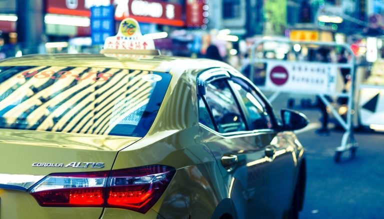 Taiwan travel tips for using taxis in Taipei at night markets with busy street scene and city lights