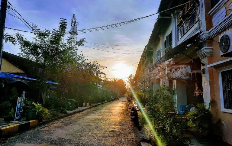 Things to do in Kampot - Sunset street with warm light colonial buildings and quiet atmosphere