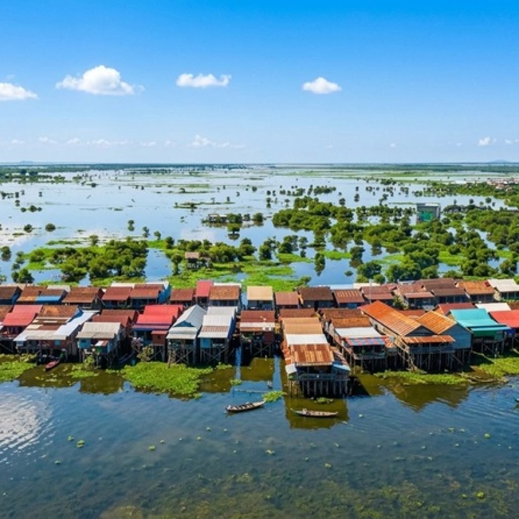 tonle sap floating village aerial view stilt houses flooded landscape cambodia