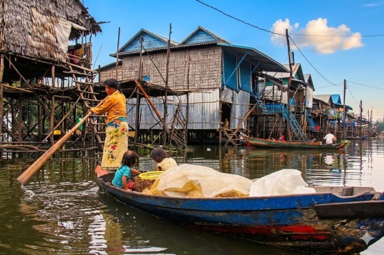 tonle sap floating village family boat stilt houses cambodia daily life Caption Description