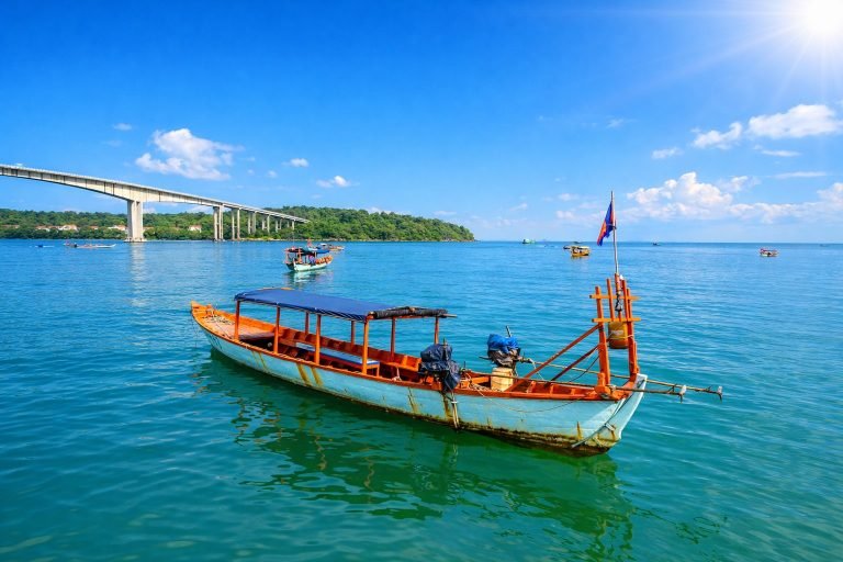 Sihanoukville Cambodia fishing boat on clear blue water with bridge and sunny sky Caption: Description: