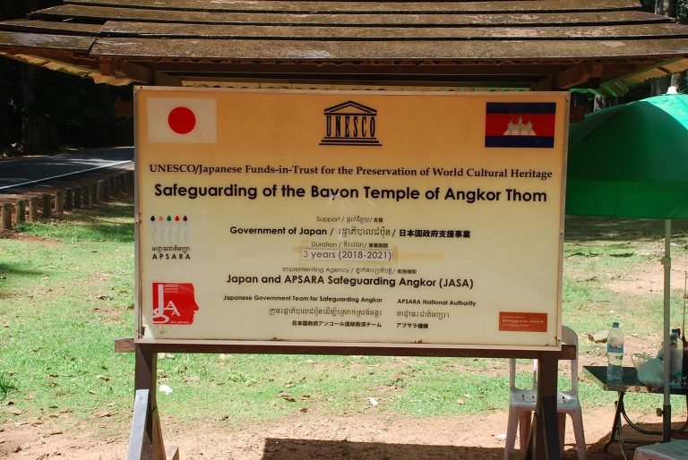 UNESCO sign for Bayon Temple restoration project at Angkor Thom supported by Japan in Cambodia
