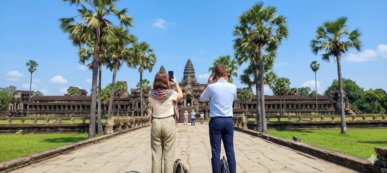 sim card cambodia travelers using smartphones angkor wat temple cambodia connectivity Caption: Description: