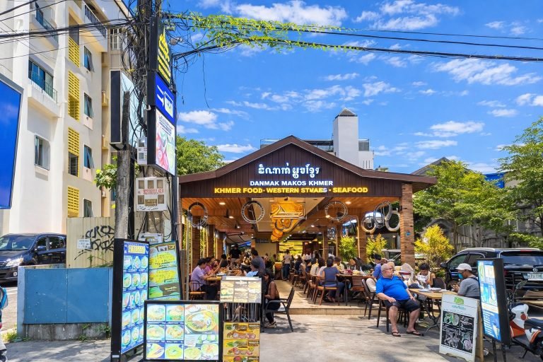 Things to do in Siem Reap include dining at local restaurants with outdoor seating under blue skies in a lively street setting