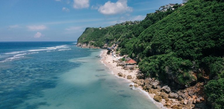 Turquoise coastline and limestone cliffs surrounding Bingin Beach in Bali beaches near Uluwatu Caption: Description: