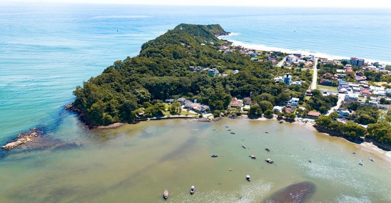 Aerial view of a forested coastal island highlighting the best islands in Brazil Caption Description