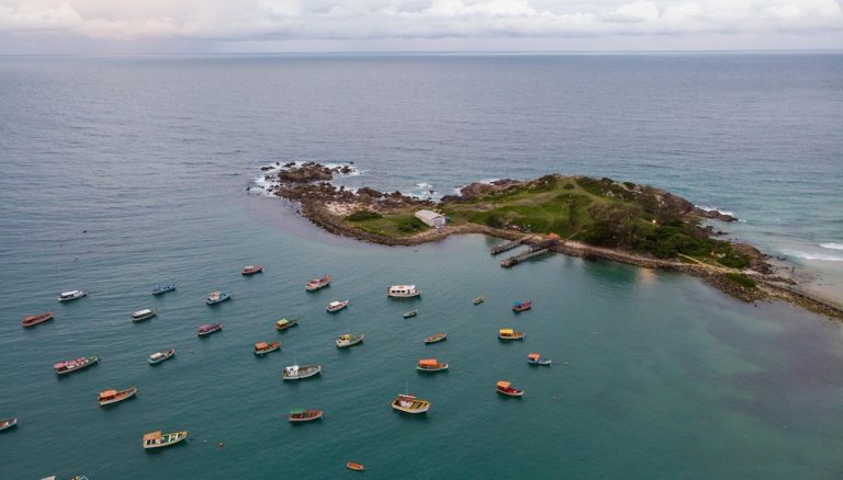 Aerial view of boats anchored near a tropical island showcasing the best islands in Brazil