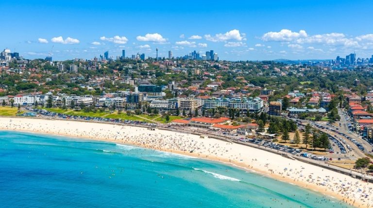 Aerial view of Bondi Beach, one of the most famous beaches in Sydney with golden sand and turquoise water Caption: Description: