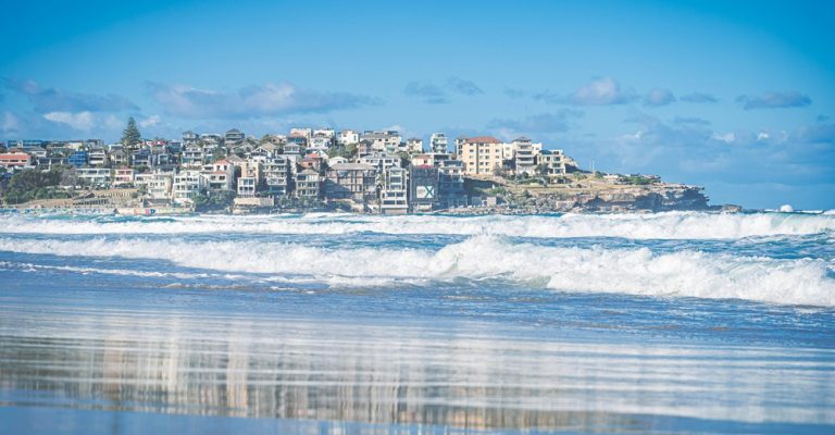 Ocean waves rolling onto Bondi Beach, one of the most famous beaches in Sydney Australia Caption: Description: