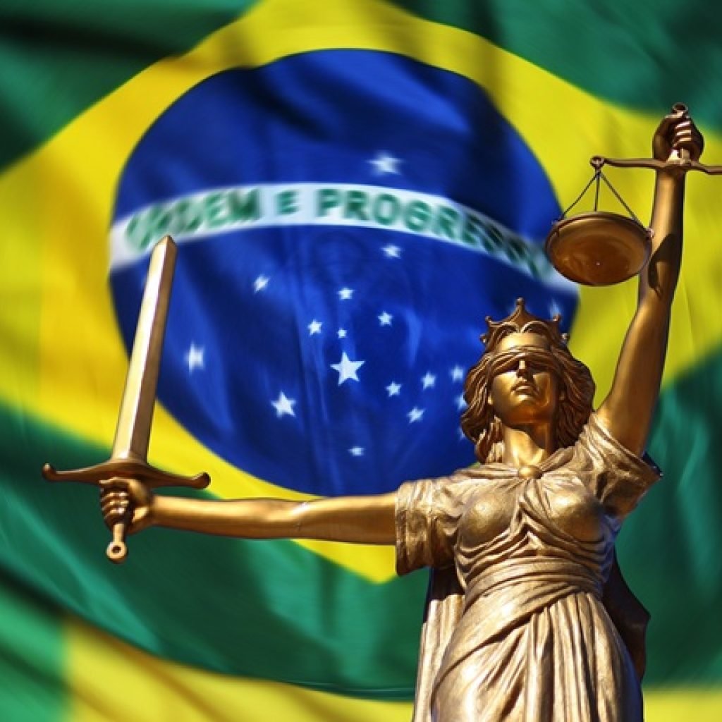 Where to stay in Brazil guide with Brazil flag and Lady Justice symbol representing safety and travel planning