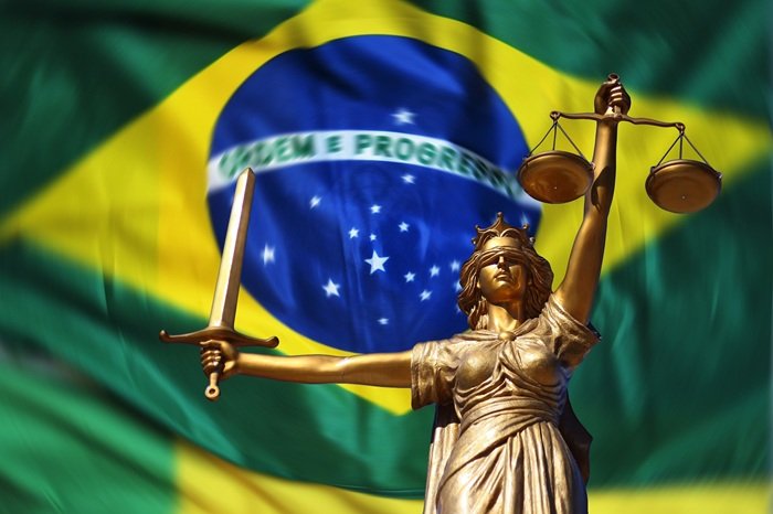 Where to stay in Brazil guide with Brazil flag and Lady Justice symbol representing safety and travel planning