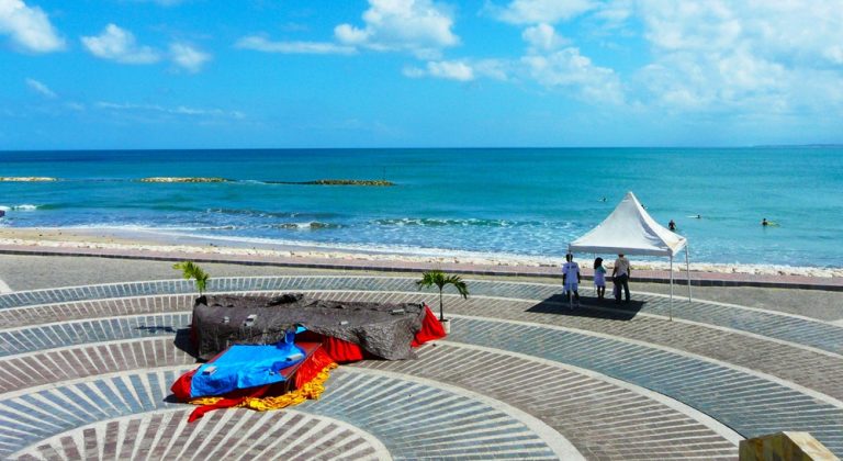 Calm ocean and beachfront promenade at Nusa Dua Beach in Bali beaches under a bright tropical sky