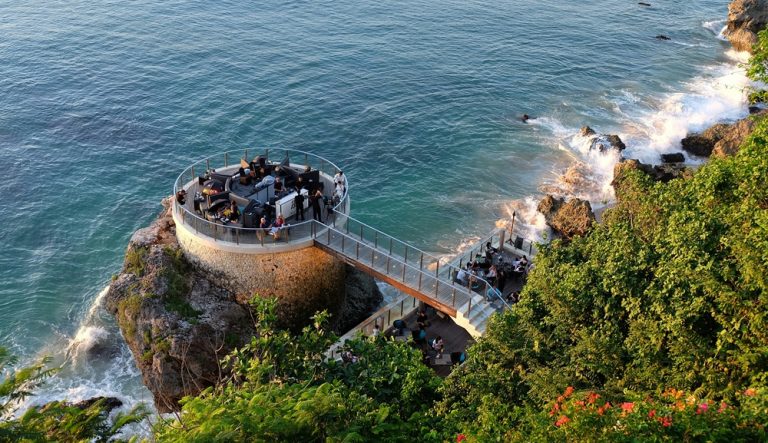 Clifftop ocean venue overlooking the coastline near Jimbaran Beach in Bali beaches during golden hour Caption: Description: