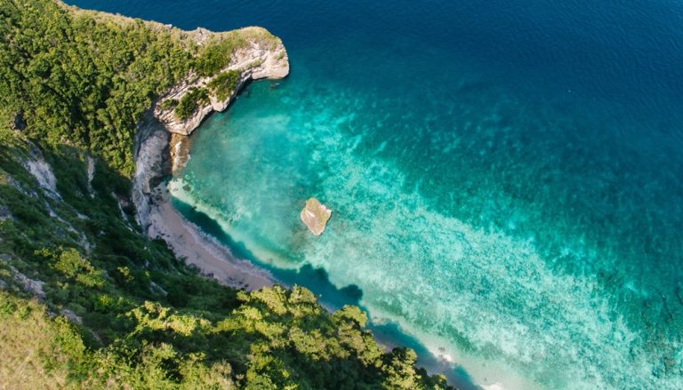 Turquoise water and dramatic cliffs above Suluban Beach in Bali beaches near Uluwatu