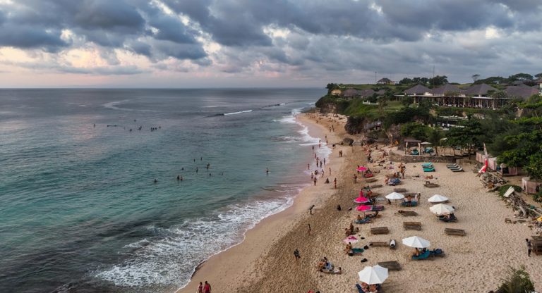 Beachfront coastline with turquoise water and seaside resorts in Nusa Dua, Bali Caption: Description: