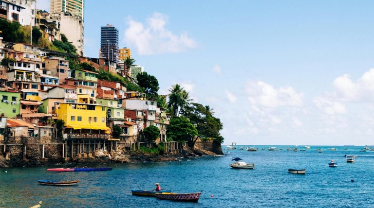 Colorful waterfront neighborhood in Salvador Brazil with fishing boats and hillside houses