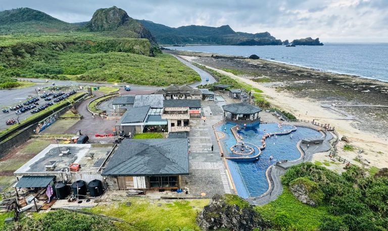 Taiwan hot springs resort beside the ocean with geothermal pools, rugged coastline, and dramatic coastal scenery