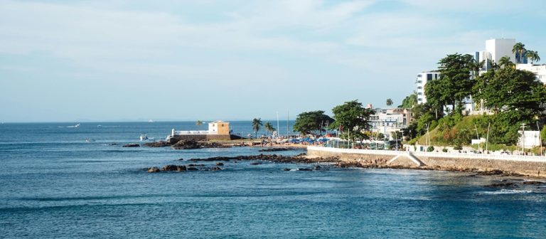 Scenic waterfront coastline in Salvador Brazil with ocean views and historic seaside fort