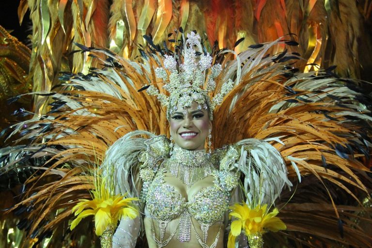 Brazil Carnival performer wearing an elaborate feathered samba costume during a Rio de Janeiro Carnival parade