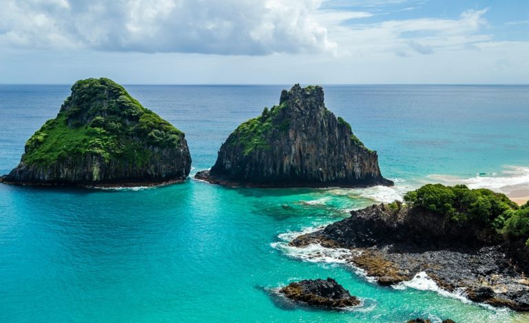 Dramatic sea stacks and turquoise ocean at Fernando de Noronha, one of the best islands in Brazil