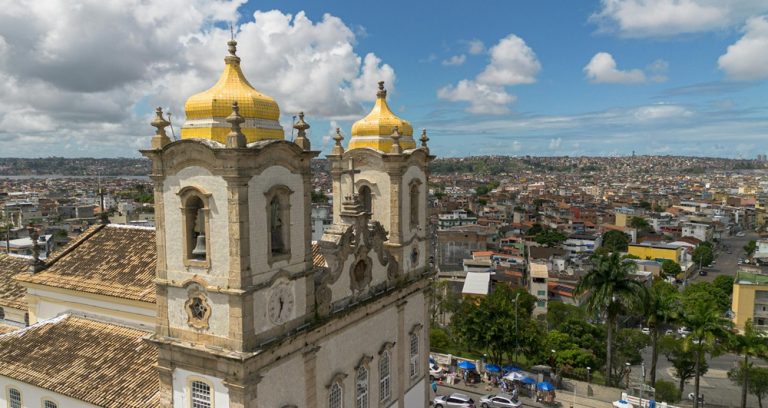 Historic church and panoramic city view showing where to stay in Salvador, Brazil Caption: Description: