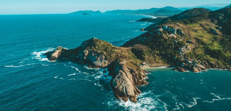 Dramatic rocky coastline and island landscape showcasing the best islands in Brazil