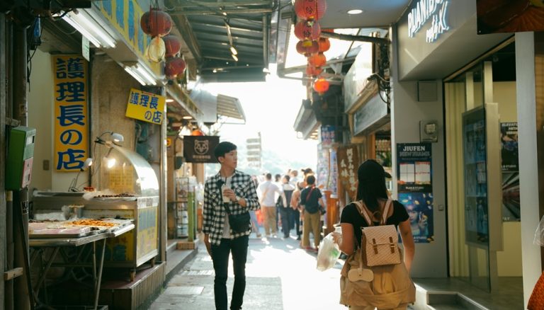 Visitors walking through a narrow shopping alley in Jiufen, Taiwan Caption: Description: