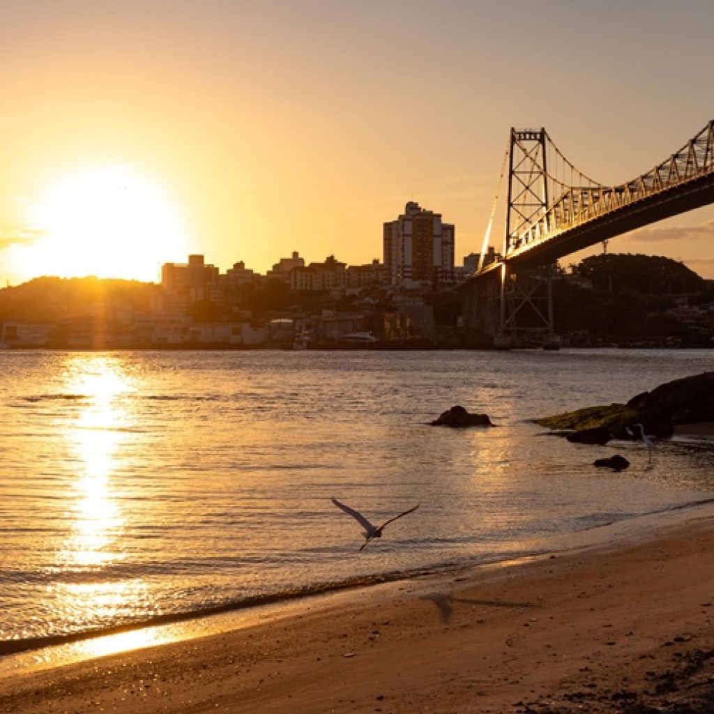 Things to Do in Florianópolis Brazil sunset view over Hercílio Luz Bridge and Santa Catarina Island shoreline