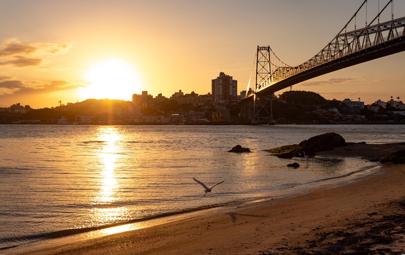 Things to Do in Florianópolis Brazil sunset view over Hercílio Luz Bridge and Santa Catarina Island shoreline