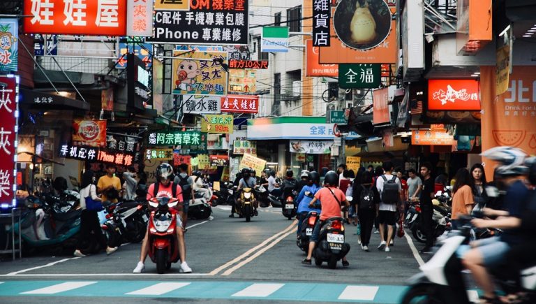 Busy Taipei street scene with shops and scooters illustrating taiwan visa entry requirements for international visitors