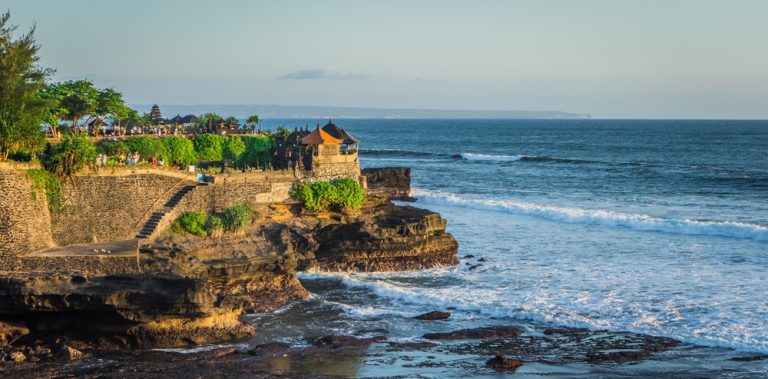Tanah Lot Temple overlooking the Indian Ocean in Bali, one of the iconic landmarks featured in Bali travel tips for first-time visitors