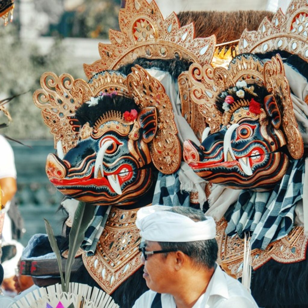 Traditional Balinese cultural ceremony and ornate festival masks in Bali – is Bali safe for tourists exploring local culture