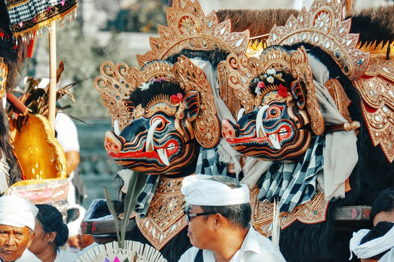 Traditional Balinese cultural ceremony and ornate festival masks in Bali – is Bali safe for tourists exploring local culture