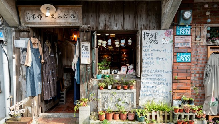 Traditional wooden storefront and local boutique in Jiufen, Taiwan Caption: Description: