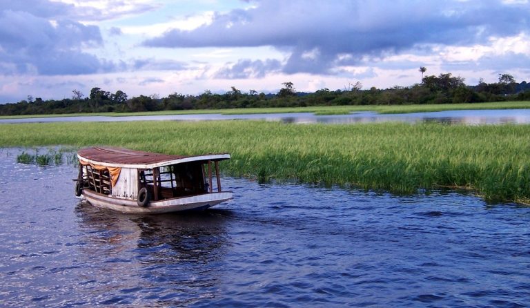 Traditional wooden river boat in an Amazon Rainforest Brazil Guide journey near Manaus